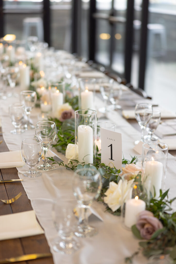 wedding-centerpiece-tablescape-roses-candles-white-purple-farm-table-reception