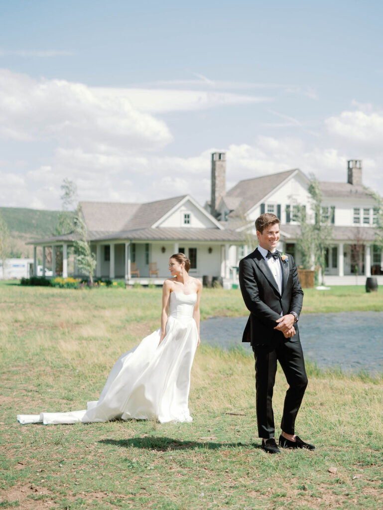Groom awaits his bride during a romantic first look at 4U Ranch in Peoa, Utah, before their luxury destination wedding planned by Shellie Ferrer Events.