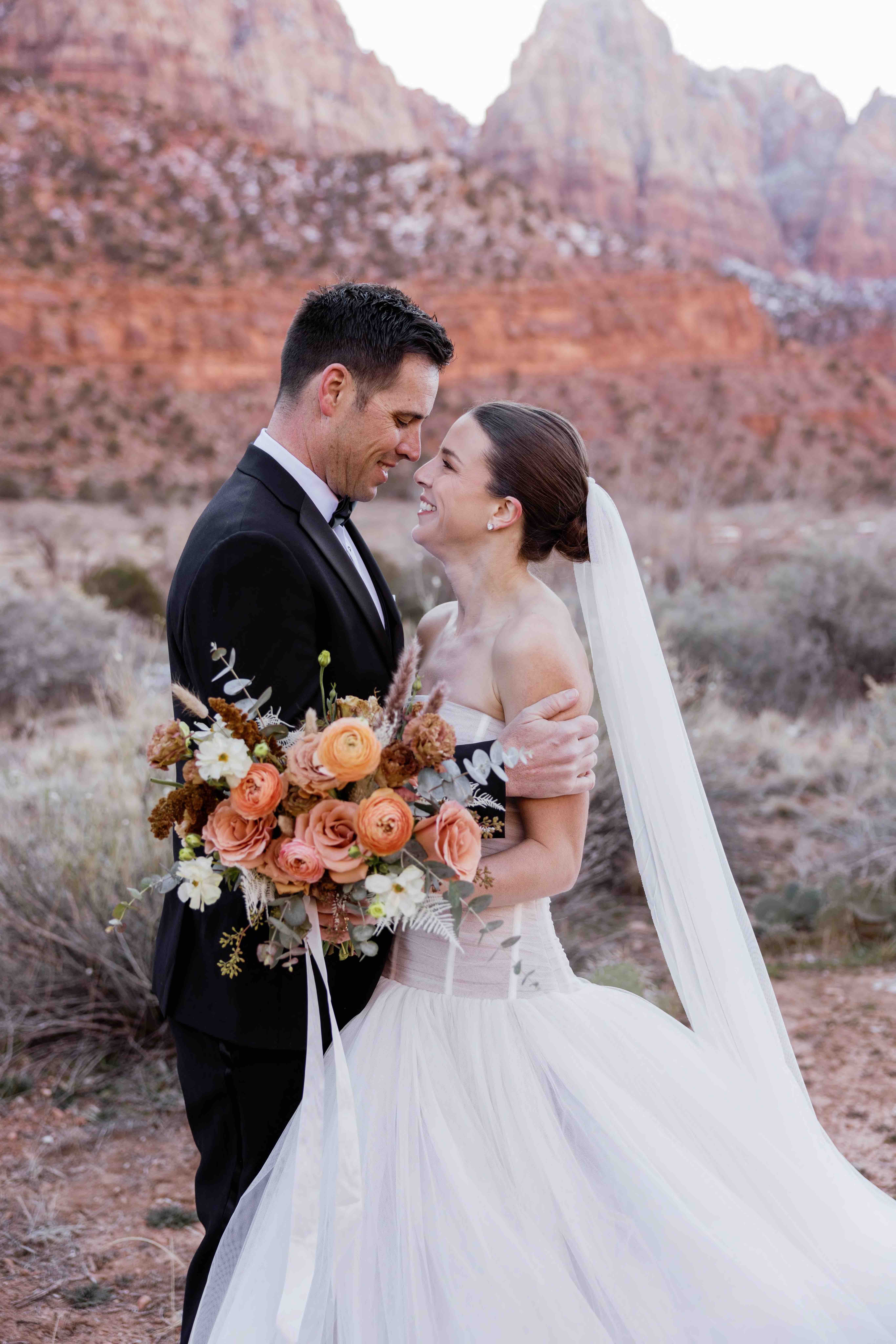 Bride and groom at a winter destination wedding in Zion National Park, Utah, planned by Shellie Ferrer Events.