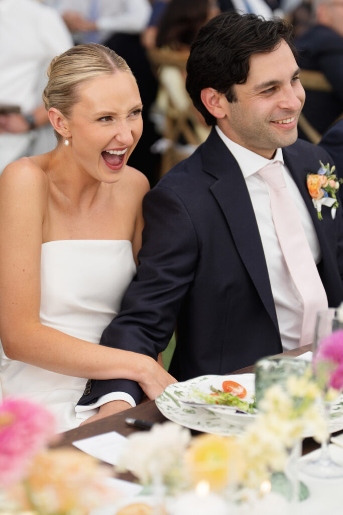 Bride and groom laughing together during the wedding reception at Snowpine Lodge in Little Cottonwood Canyon, Utah.